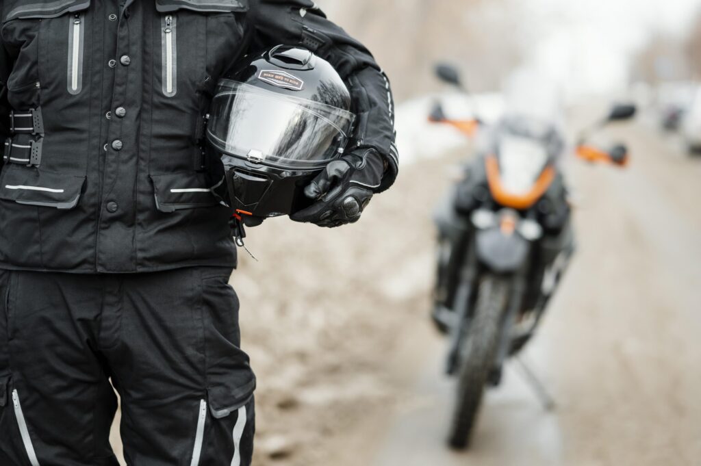 men riding motorcycle winter day